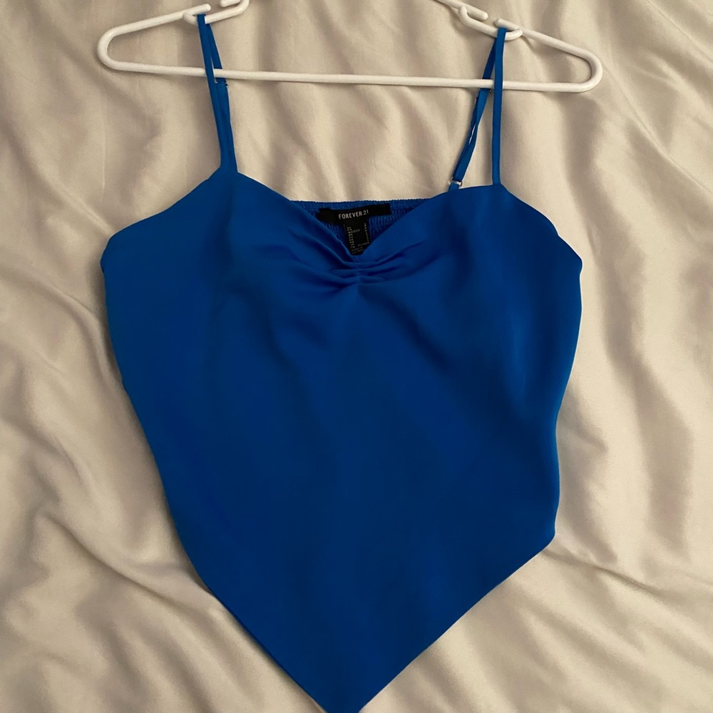 Blue cami top with adjustable straps.